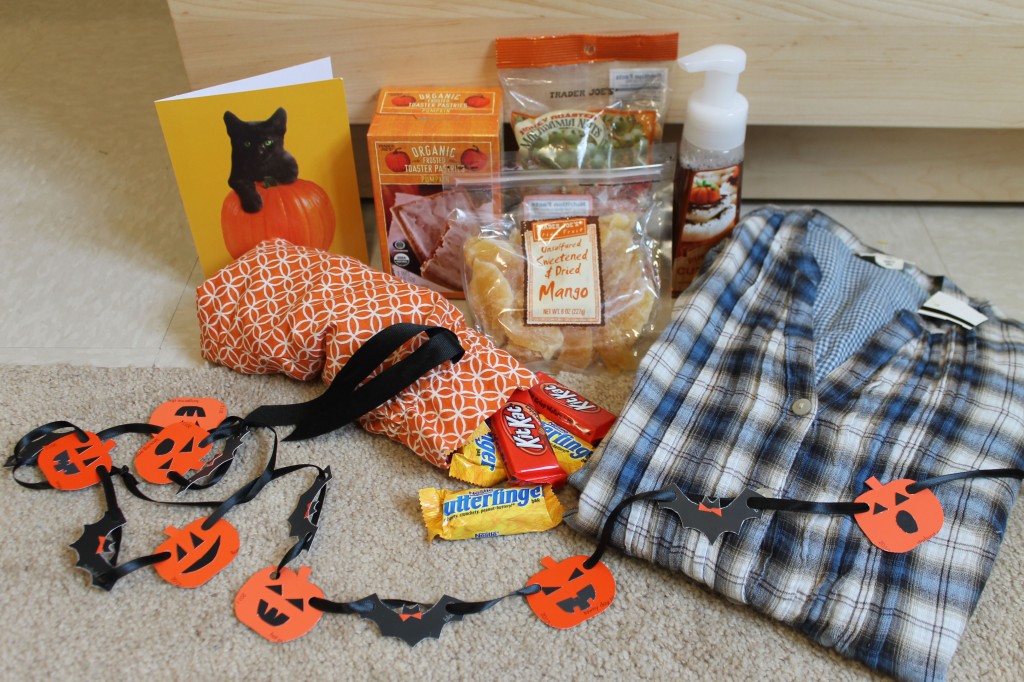 Halloween candy, some sweet snacks, a cozy flannel button-down, and an adorable garland!