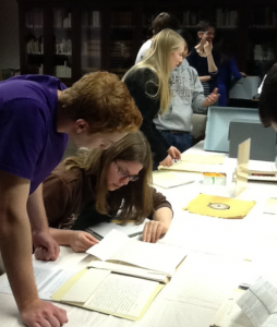 Students look at archival material from the Ostransky collection