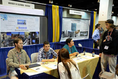Students inquiring about a school at their exhibition room booth. (Image obtained from www.geosociety.org)