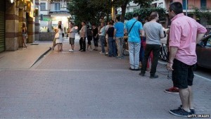 A long queue of Greek citizens queues for the ATM. Source: http://www.bbc.com/news/business-33303540.