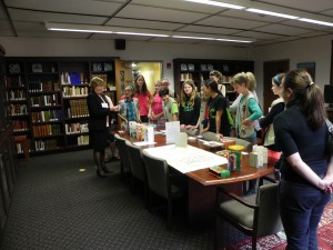 Jane Carlin speaks to a Girl Scout troop in the rare books room of Collins Memorial Library the evening of the reception for the PSBA Member's Exhibition. photo credit: Mark Hoppmann