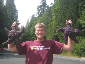 Stephen Reller holds up two six-pound sea stars!