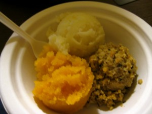 Haggis [vegetarian] is the brown stuff, "Neeps" (turnips) are orange, and "Tatties" (potatoes) are white. Yum!