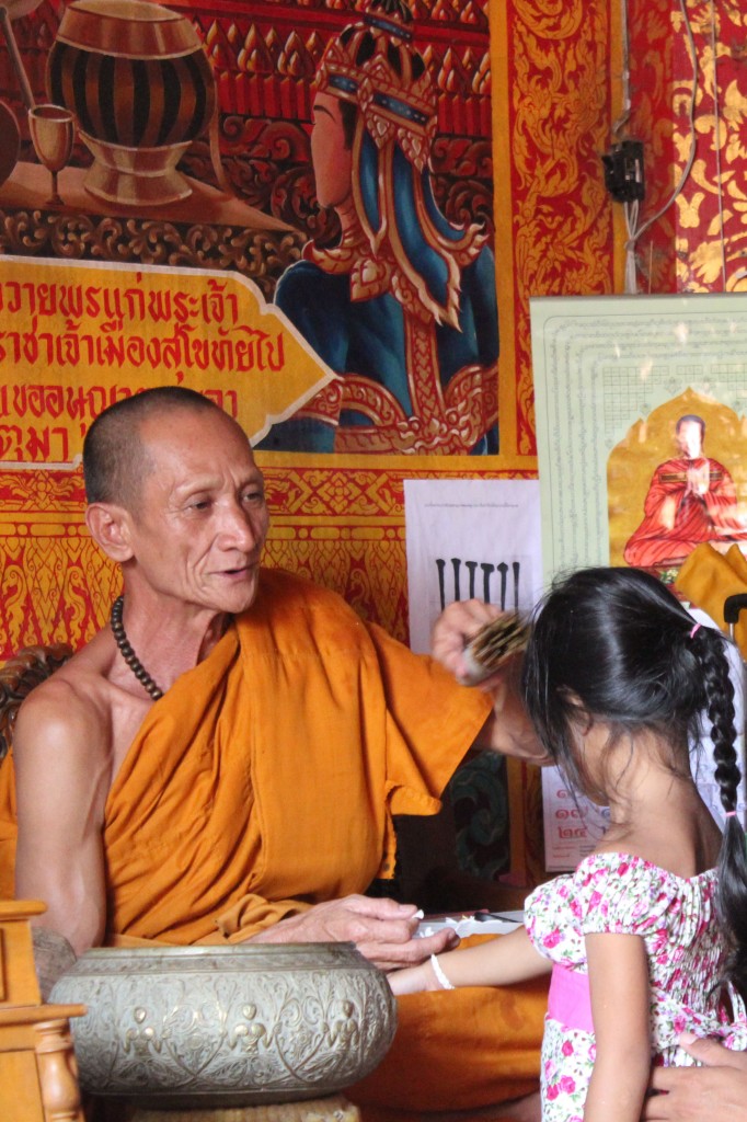 Monk blessing a child