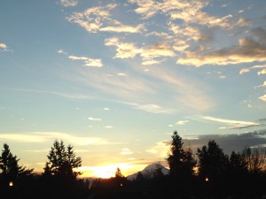 sunrise behind mt. rainier