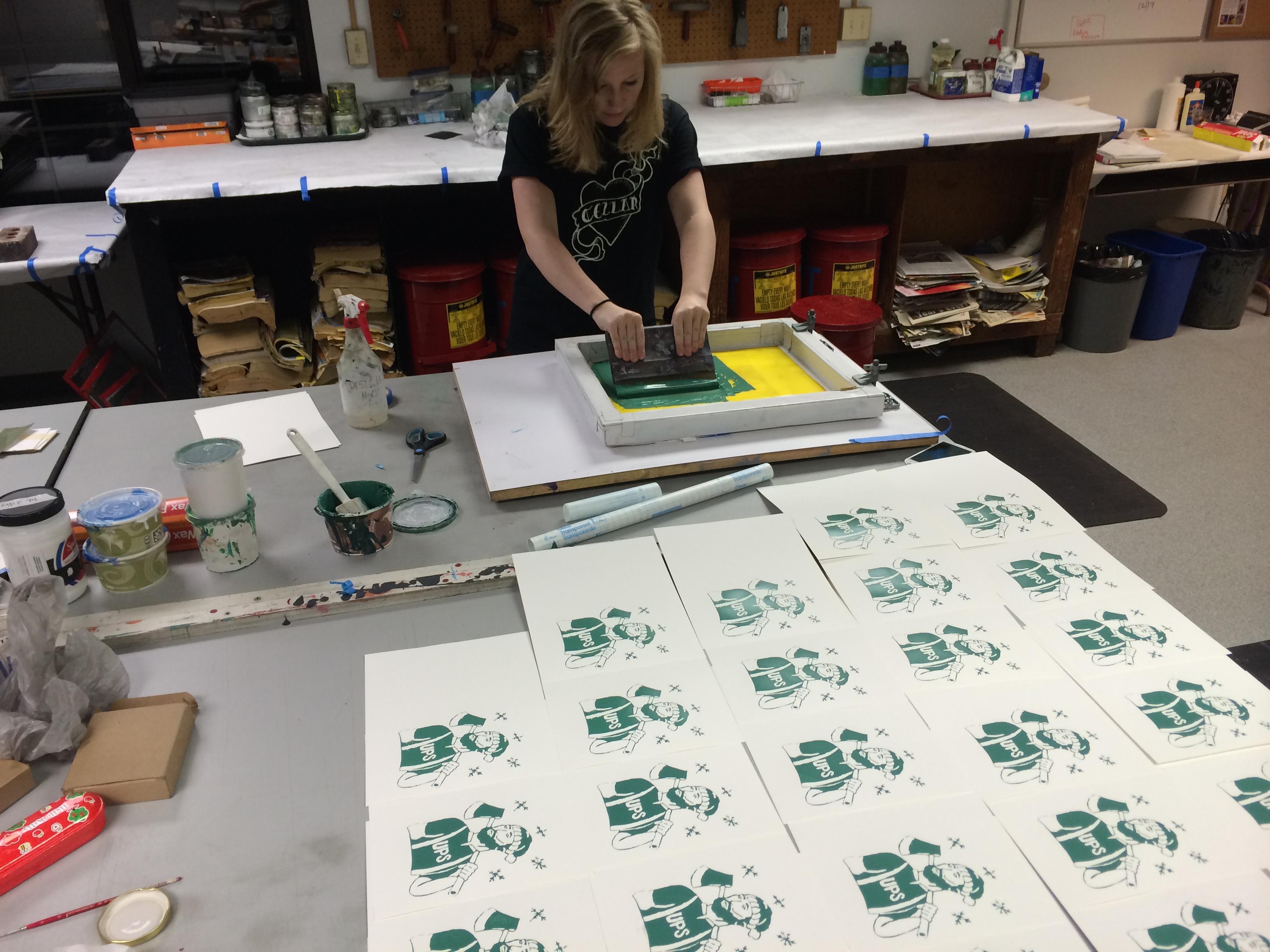 Marissa Irish'16 screen printing some Logger-themed holiday cards designed by Carly Brock'16!