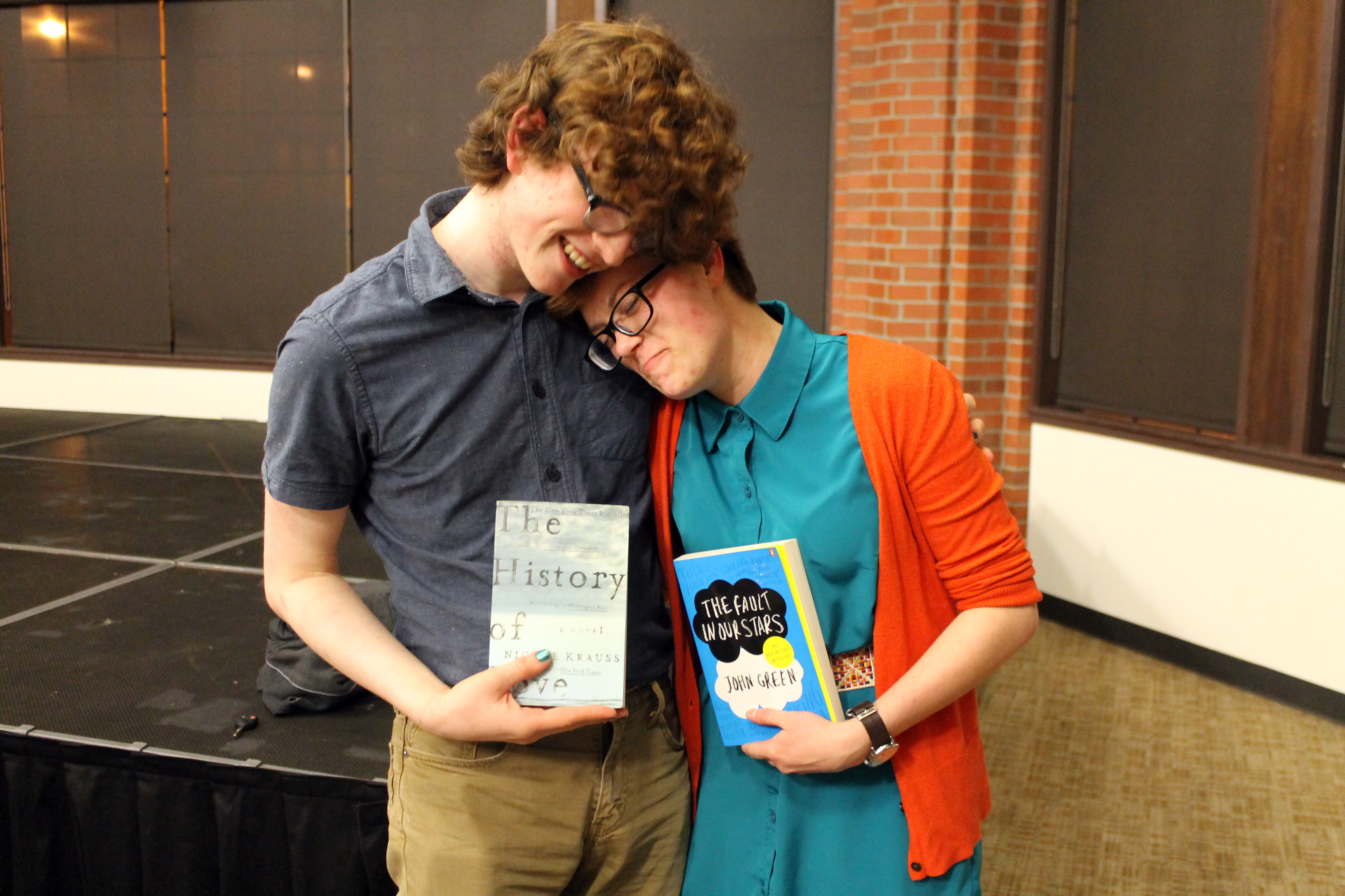 Chris Kelly and Nicole share a moment with their new books