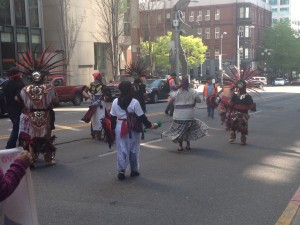 Aztec dancers marching through downtown Seattle with the Caravana