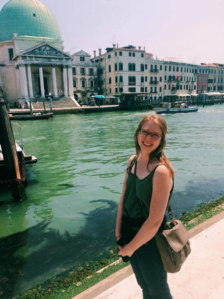 The darling Carly Brock '16 posing in front of the Venice canals